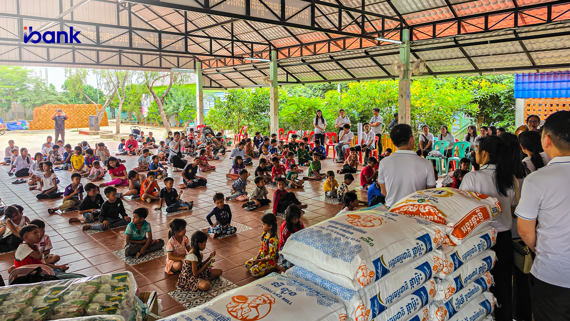 Photo: The iBank Team engaging with children at the Branch Center in Kamboul District, Phnom Penh.